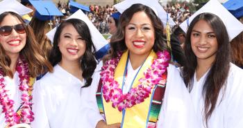 Group of four Smiling Female Graduates 