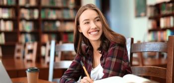 Smiling student in library