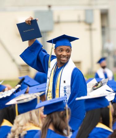 Student with Diploma