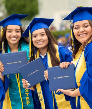 Gradutes Holding Diploma