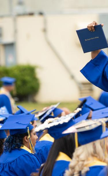 Student with Diploma