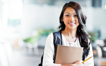 Female Student Holding a Notebook