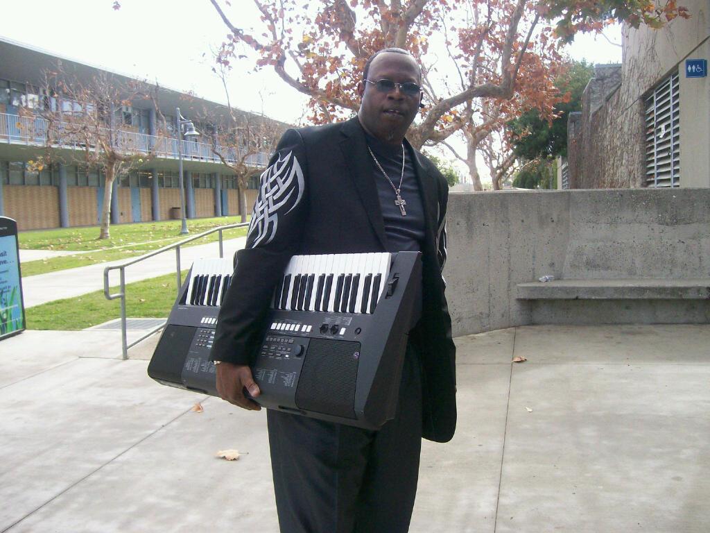 Ned Ebbs Holding his Piano Keyboard
