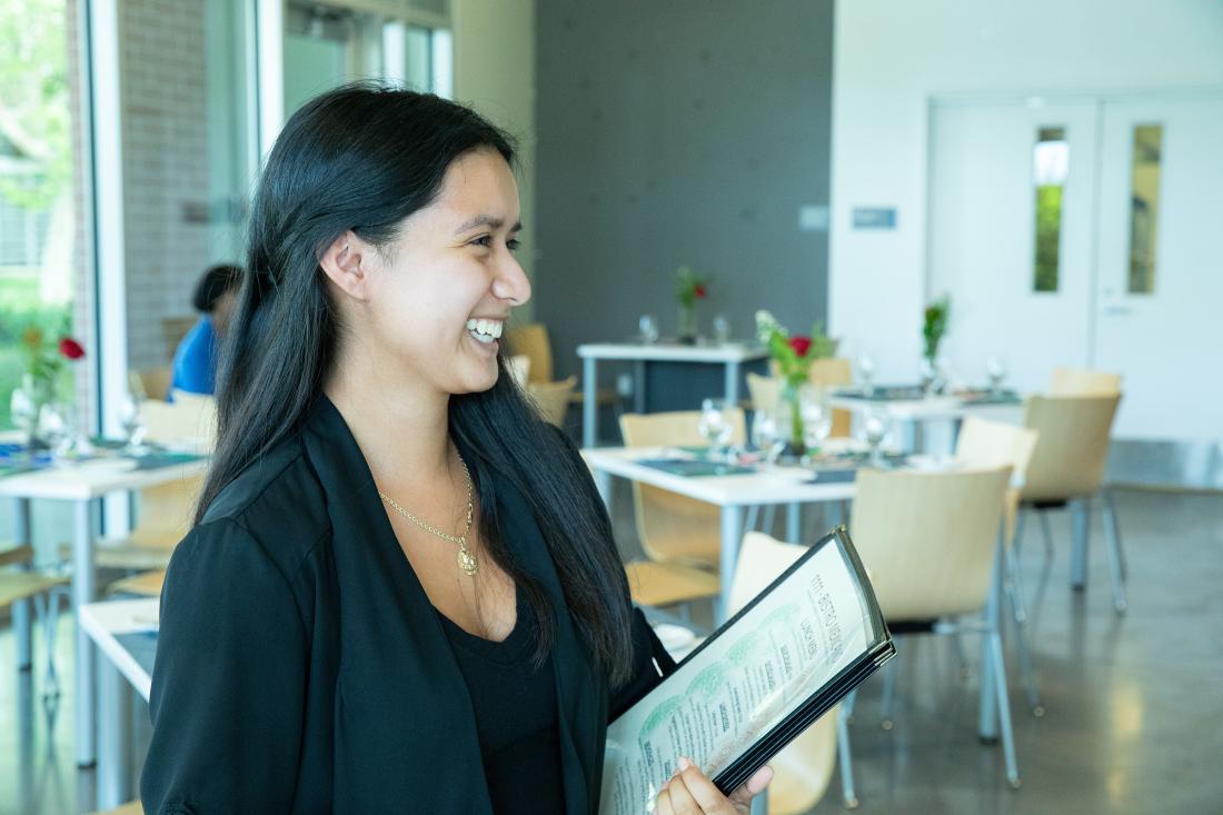 Smiling Waitress in Restaurant